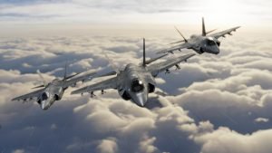 Frontal view of three F-35 fighter jets flying in formation above the clouds