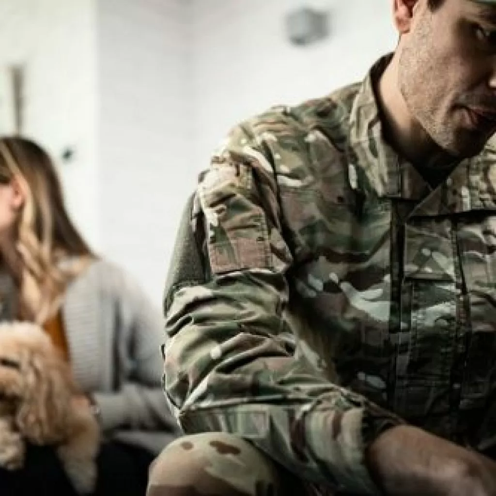 Sad Soldier sits with his back to his sad wife; military court martial appeal; experienced court-martial appeals lawyer; court-martial appeals process