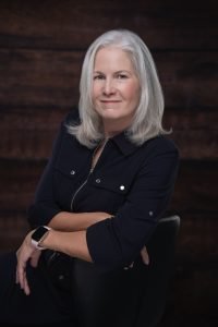 Client Success Manager Peggy Kageleiry sits for a professional portrait photo; Law Office of Peter Kageleiry, Jr., LLC.