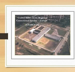 A graphic with an embedded Aerial photo of the United States Army Corrections Facility-Europe (USARCF-E); pre-trial confinement; Sembach, Kaserne confinement